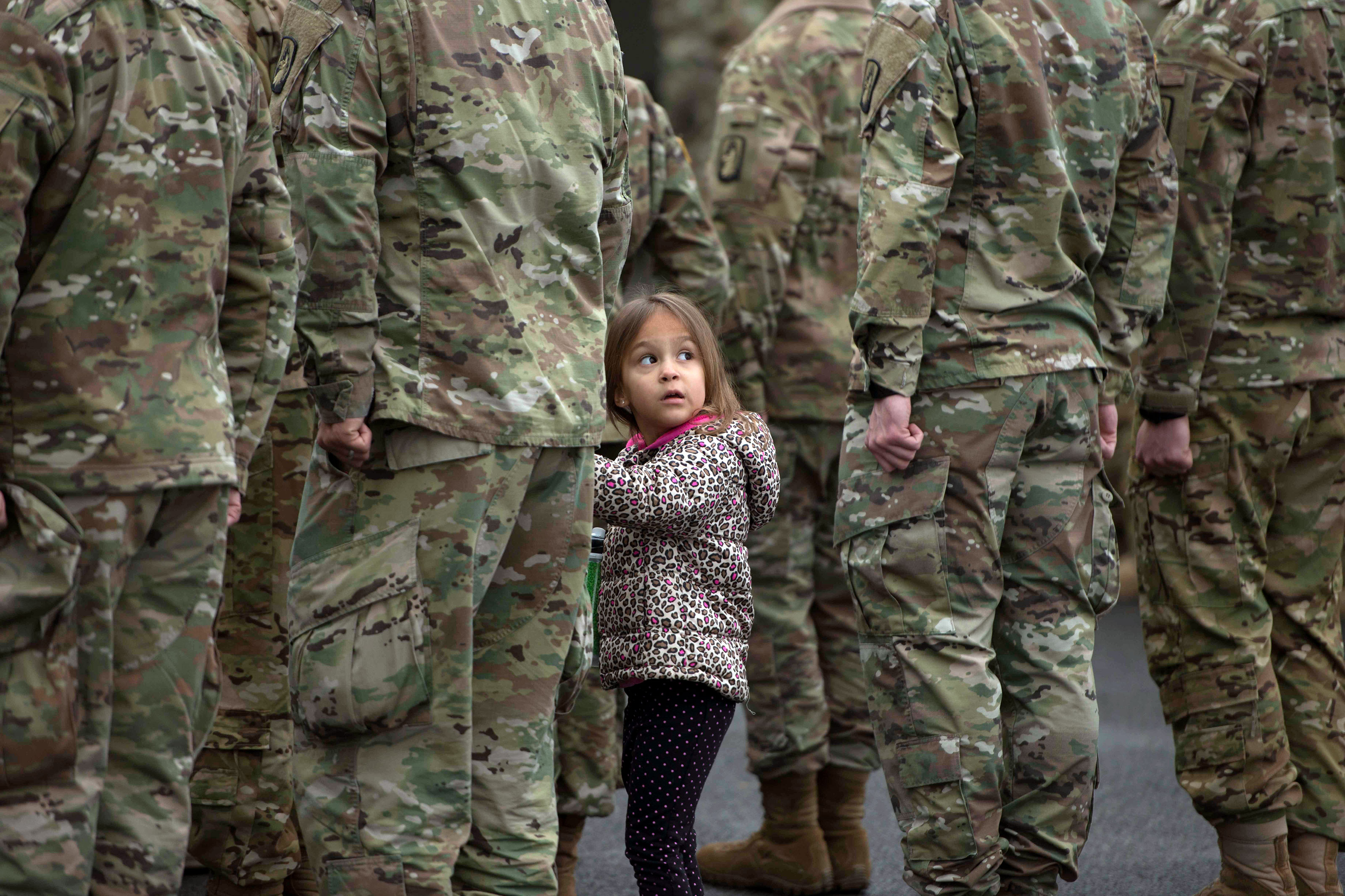 A little girl holds her father’s hand during the 1-214th GSAB annual &quot;Family Safety Day&quot; in Hessen, Germany. (U.S. Army/Paul Hughes)