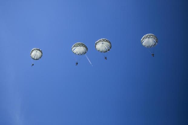 FILE PHOTO -- Static-line parachutists descend from the sky during International Jump Week 2017 near Bitburg, Germany, July 13, 2017 (U.S. Marine Corps/Cpl. Jodson B. Graves)