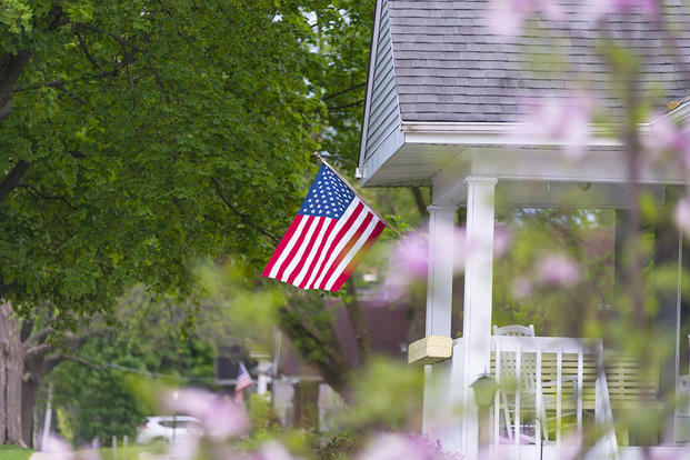 American flag on a house porch