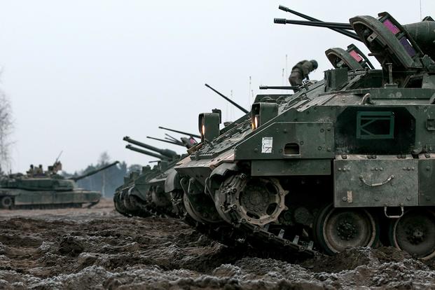 U.S. Army M2 Bradley Fighting Vehicles idle on the fields of Presidenski Range in Trzebian, Poland, during a platoon combined arms live fire exercise (CALFEX) on March 26, 2018. (U.S. Army/Spc. Dustin D. Biven)