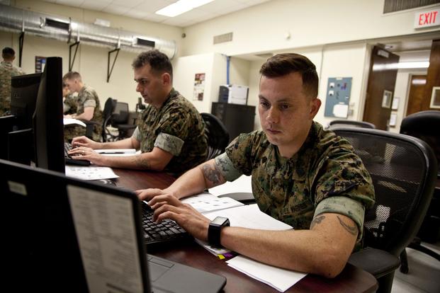 FILE -- U.S. Marines assigned to the Cyber Security Technician course, Marine Corps Communications-Electronics School, work on a assignment at Marine Corps Base Twentynine Palms, Calif., March 15, 2017. (U.S. Marine Corps/Lance Cpl. Jose Villalobosrocha)