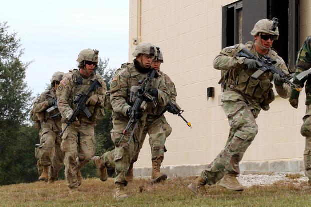 Troopers from 1st Squadron “Tiger,” 3rd Cavalry Regiment, maneuver around buildings during an urban training exercise Dec. 7, 2017 on Fort Hood, Texas. (U.S. Army/Staff Sgt. Taresha Hill)