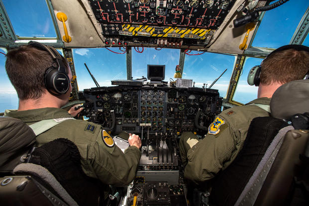 Capt. Scott Duguay, the aircraft commander, and Maj. John Chrampanis, the instructor pilot, both with the 118th Airlift Squadron, Bradley Air National Guard Base, Connecticut, fly a C-130 Hercules with simulated medical patients from Fort McCoy, Wisconsin to Cincinnati Northern Kentucky International Airport during Patriot North 18 July 18, 2018. (U.S. Air National Guard photo/Cameron Lewis)