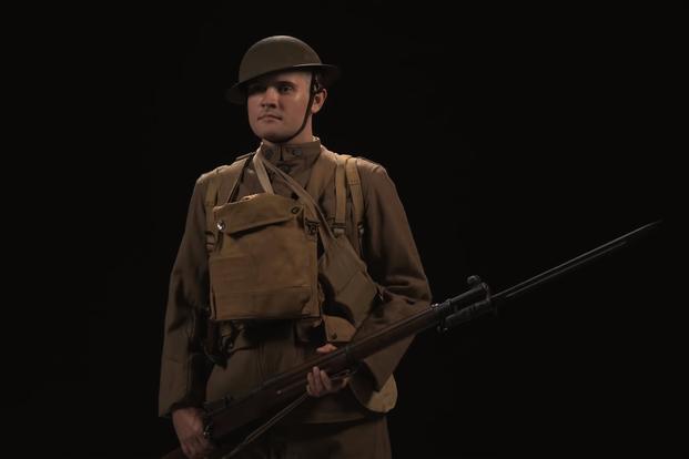 A model stands in a replica World War I U.S. Army "Doughboy" uniform. (YouTube/LionHeart FilmWorks)