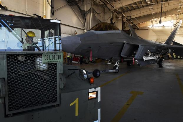 F-22 Raptor crew chiefs from the 1st Aircraft Maintenance Squadron, Langley Air Force Base, Virginia, tow an aircraft at Tyndall Air Force Base, Florida, Oct. 18, 2018. (U.S. Air Force/Staff Sgt. Matthew Lotz)