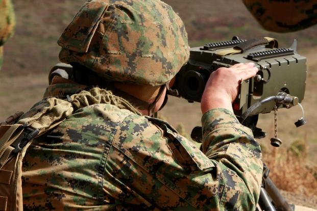 A Marine with 1st Air Naval Gunfire Liaison Company looks through a Portable Lightweight Designator Range finder during a combined arms exercise with the Japanese Ground Self Defense Force, Feb. 12. (Photo: U.S. Marine Corps)