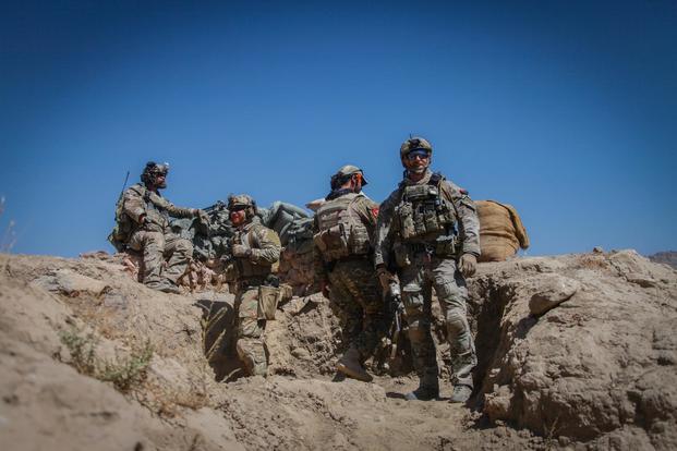 U.S. Special Forces Soldiers and an Afghan agents from the NMRG scan their surrounding area after a firefight with the Taliban during an operation in the Tagab district, Kapisa province, Afghanistan, Sept. 20, 2016. (U.S. Army/Sgt. Connor Mendez)
