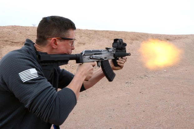 Dan Blackburn, design engineer and owner of United Defense Corporation, firing his new AK103X series of custom-built, hybrid AK rifles and carbine at the SHOT Show 2019 industry day at the range. (Matthew Cox/Staff)