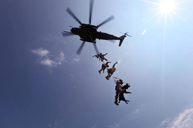 Marines with Marine Corps Special Operations Command conduct a Special Patrol Insertion/Extraction exercise on a CH-53E aboard Marine Corps Base Camp Lejeune, North Carolina in 2013. This training has helped the MARSOC MPC program in developing what will become the standard operating procedures. (Anthony Carter/U.S. Marine Corps)