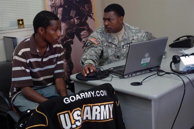 Staff Sgt. Roger L. Whaley speaks with Phillip McDonald about the possibility of becoming a journalist or X-ray technician for the Army at the U.S. Army Recruiting Station in Radcliff, Ky. (U.S. Army/Sgt. Carl N. Hudson)