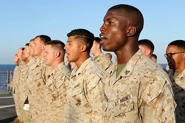 Members of the 24th Marine Expeditionary Unit sing the “Marines’ Hymn” during a Corporal’s Leadership Course graduation aboard the USS Fort McHenry (LSD 43) on April 4, 2015. (U.S. Marine Corps photo by Sgt. Devin Nichols)