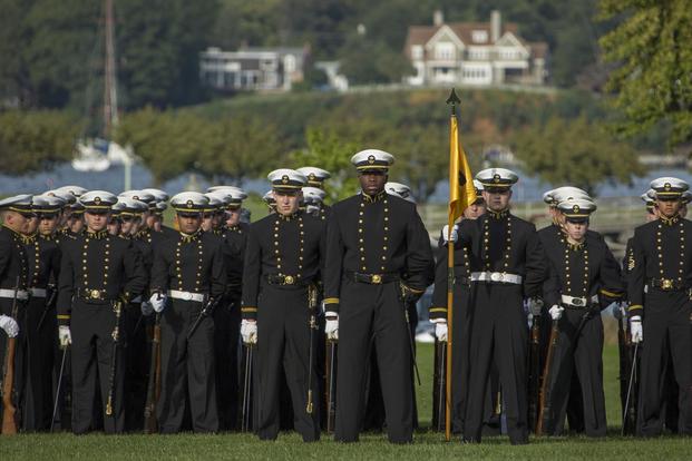Midshipmen with the U.S. Naval Academy (USNA) stand at parade rest during the Second Class Parents Weekend Formal Dress Parade at the USNA, Annapolis, Md., Oct. 7, 2016. (U.S. Marine Corps/Cpl. Samantha K. Braun)