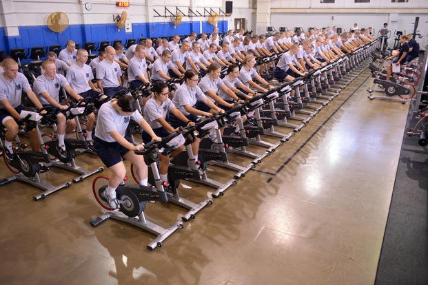 Coast Guard recruit company Juliet-190 become the first company to try the training center's new stationary bikes, Sept. 10, 2014. The bikes will replace the aging models and provide a safer and more intense workout for recruits going through basic training. (John Edwards/U.S. Coast Guard)