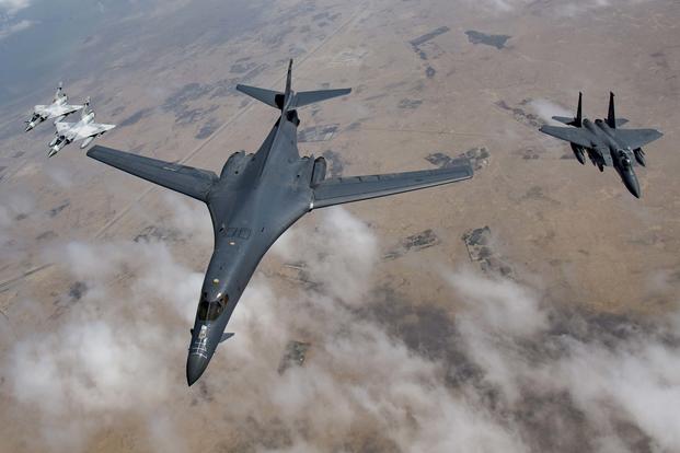 A U.S. Air Force B-1B Lancer bomber, an F-15E Strike Eagle and two Qatari Mirage 2000s fly in formation during Joint Air Defense Exercise 19-01 in Qatar on Feb. 19, 2019. (U.S. Air Force photo by Staff Sgt. Clayton Cupit)