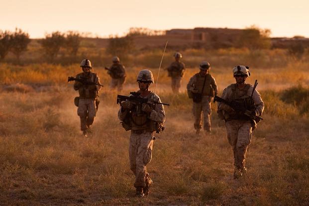 Marines from India Company, 3rd Battalion, 3rd Marine Regiment, make their way through Trek Nawa, Afghanistan, back to Patrol Base Poole after completing Operation Mako, Sept. 21, 2010. (U.S. Marine Corps/Sgt. Mark Fayloga)