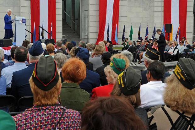 Veterans gather for the 15th anniversary dedication of the Women in Military Service for America Memorial.