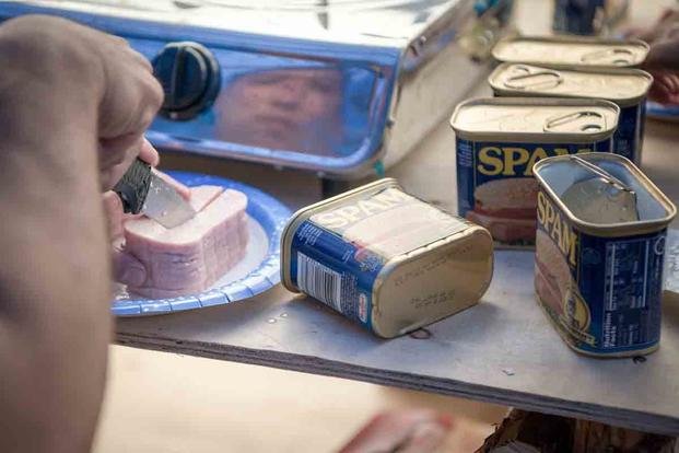 The legend was born of just pork shoulder, water, salt, sugar, and sodium nitrate. Potato starch was added in 2009 to prevent the gelatinous goo from forming in the can. (U.S. Navy/Mass Communication Specialist 2nd Class Seth Coulter)