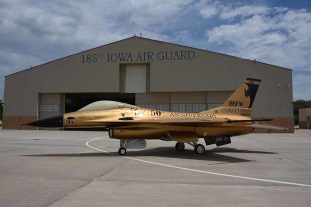 A gold U.S. Air Force F-16A Falcon from the Iowa Air National Guard is on the ramp in Sioux City, Iowa on June 30, 2022. The jet is painted with commemorative anniversary paint scheme that replicates the unit’s 50th anniversary gold jet as it appeared in 1996. (U.S. Air Force photo Senior Master Sgt. Vincent De Groot) A gold U.S. Air Force F-16A Falcon from the Iowa Air National Guard.