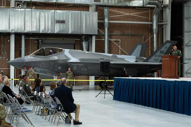 Lt. Col. Brandon Nauta, 65th Aggressor Squadron commander, assumes command of the 65 AGRS during an activation ceremony at Nellis Air Force Base, Nevada, June 9, 2022. The aggressor squadron acts as an opposing force in sorties by replicating enemy tactics, techniques and procedures. (U.S. Air Force photo by Airman 1st Class Josey Blades) Lt. Col. Brandon Nauta, 65th AggressoF-35 at an activation ceremony at Nellis Air Force Base, Nevada.