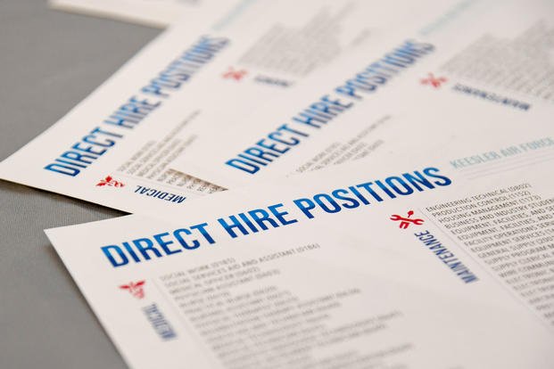 Educational flyers are displayed during a job fair at Keesler Air Force Base, Mississippi.