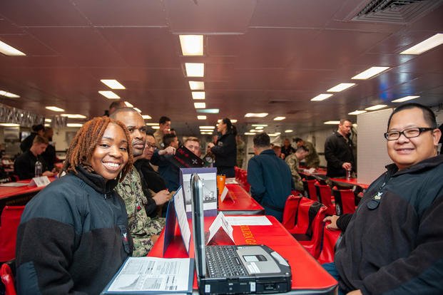 Sailors explore different career paths within the Navy during a career fair held on the mess decks aboard USS Boxer (LHD 4).