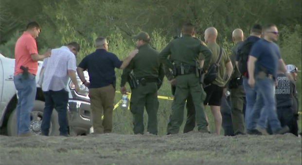 authorities stage near where a helicopter flying over the U.S.-Mexico border in Texas crashed