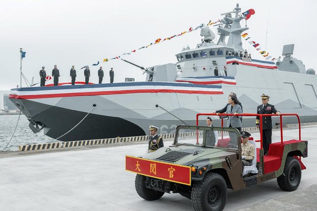 Taiwan's President Tsai Ing-wen inspects the commissioning of two new navy ships