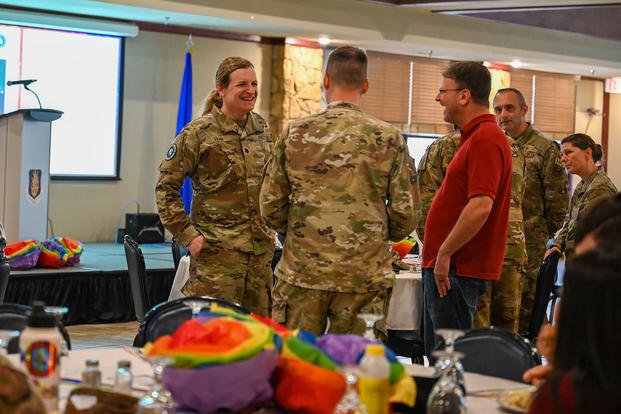 U.S. Space Force Lt Col. Bree Fram, an astronautical engineer, talks with attendees at a Pride Month event at Altus Air Force Base, June 5, 2023. (Airman 1st Class Heidi Bucins/U.S. Air Force photo) U.S. Space Force Lt Col. Bree Fram, an astronautical engineer, talks with attendees at a Pride Month event at Altus Air Force Base.