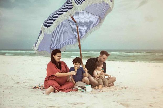 Katelyn Hitchcock and her husband Caleb, a Marine veteran, with their family. (Photo Courtesy of Rawls Law Group) Katelyn Hitchcock and her family at the beach