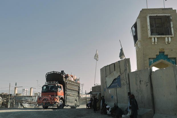 People wait near the closed gate at the Spin Boldak border crossing with Pakistan, after the border was shut for nearly two weeks following clashes between Afghan and Pakistani forces, in Kandahar province, Afghanistan, Thursday, Oct. 23, 2025. (AP Photo/Sibghatullah) People wait near the closed gate at the Spin Boldak border crossing with Pakistan.