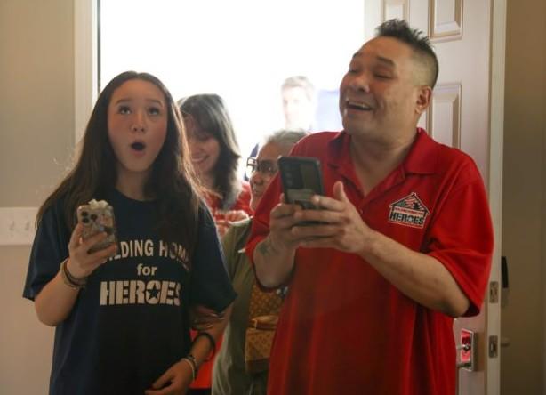 Army Staff Sgt. Tomee Phetsisouk and his family see their new home in Naperville, Illinois in September. (Photo from Building Homes for Heroes)