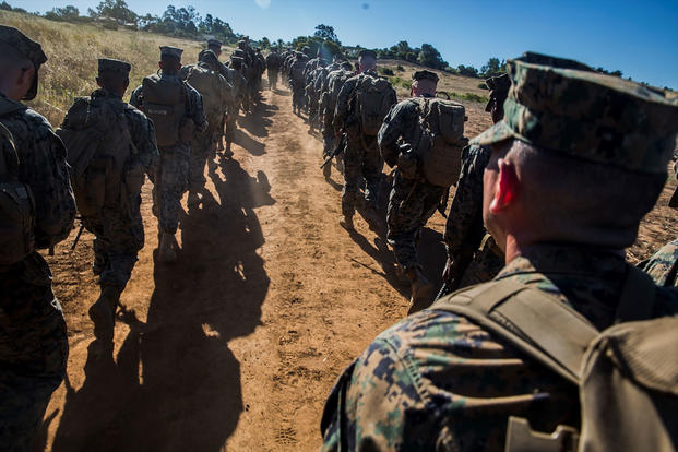 Marines and Sailors with Combat Logistics Battalion 5, Combat Logistics Regiment 1, 1st Marine Logistics Group participate in a seven mile conditioning hike on Camp Pendleton, Calif., June 27, 2017. (U.S. Marine Corps/Lance Cpl. Adam Dublinske) 