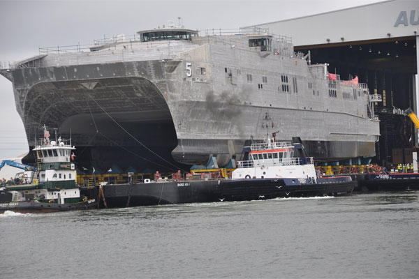 The future Military Sealift Command joint high-speed vessel USNS Trenton (JHSV 5) rolls out in preparation for launch at Austal USA shipyard. (U.S. Navy photo/Released)