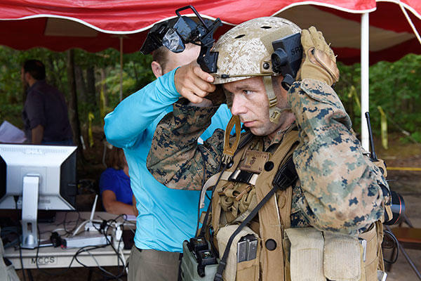 A Marine is fitted with the Augmented Immersive Team Trainer (AITT) from the Office of Naval Research during testing at Quantico, Va. (U.S. Navy/John F. Williams)