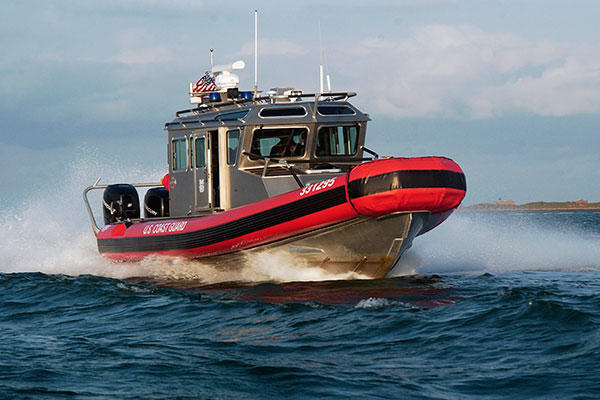 A 33-foot Special Purpose Craft - Law Enforcement boat from Coast Guard Station South Padre Island speeds through the water. (U.S. Coast Guard)