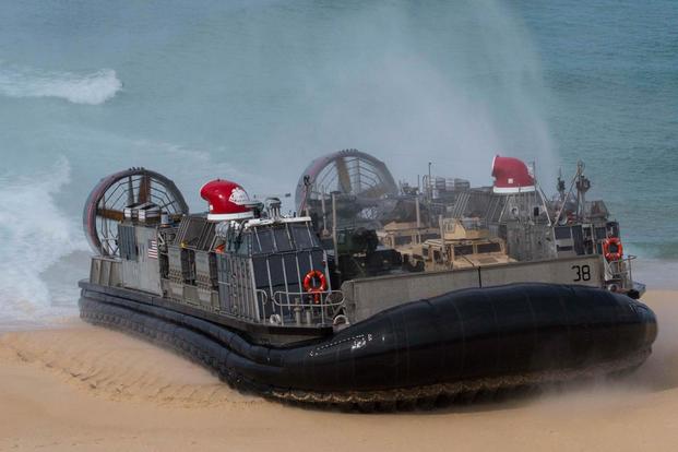 A landing craft air-cushion, or LCAC, transporting U.S. Marines and Portuguese Marines lands at Pinheiro Da Cruz, Praia Da Raposa beach, Portugal, to participate in a combined amphibious assault exercise, Oct. 20, 2015. (Photo by: Sgt. Austin Long)