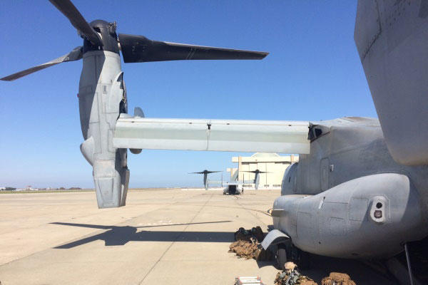 A pair of Marine Corps MV-22 Osprey tilt-rotor aircraft sit on the flight line on Tuesday at Moffett Field in California for a training exercise involving FEMA officials as part of Fleet Week San Francisco. (Photo: Military.com)
