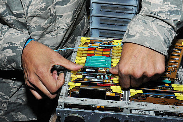 Staff Sgt. Jesse Contreras-Laurel, the 379th Expeditionary Maintenance Squadron electronic systems test set team leader from San Bernardino, Calif., tests a signal data converter at Al Udeid Air Base, Qatar. (U.S. Air Force/Tech. Sgt. James Hodgman)