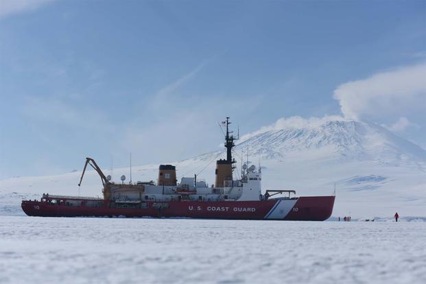 The Coast Guard Cutter Polar Star sits in fast ice in front of Mt. Erebus in McMurdo Sound, Antarctica, Jan. 7, 2016. (U.S. Coast Guard/Petty Officer 2nd Class Grant DeVuyst)