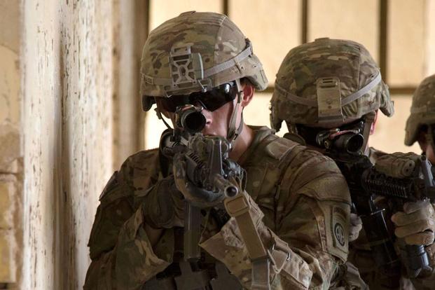 Soldiers wearing the legacy Advanced Combat Helmet, which will be replaced with the lighter ACH Gen II. (Army Photo)