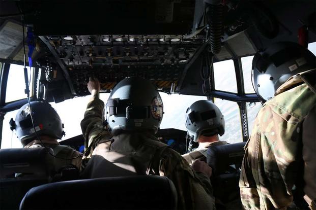 IRAQ- The C-130 crew armors up and keeps watch before landing at the first location in Iraq (Photo: Oriana Pawlyk/Military.com)