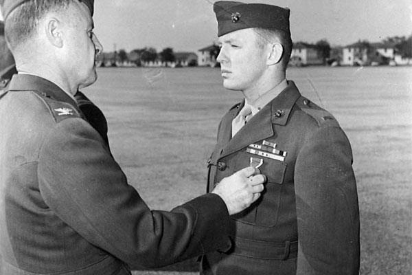 In an undated photograph, Richard Ferry, 15-year Marine veteran, receives a second purple heart for wounds received during the Korean conflict, at Marine Corps Recruit Depot Parris Island.