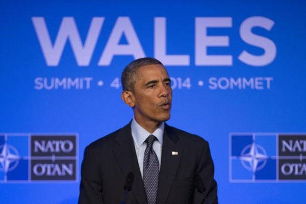 U.S. President Barack Obama speaks during a press conference at the end of the NATO summit at the Celtic Manor Resort in Newport, Wales, Friday, Sept. 5, 2014. (AP Photo/Jon Super)