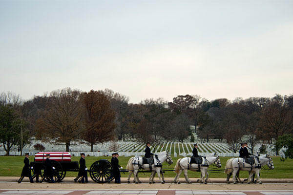 Members of the U.S. Army 1st Battallion 3rd Infantry, Caisson Platoon, carry the remains of Army Air Forces Sgt. Charles A. Gardner Dec. 4, 2014, in Arlington National Cemetery. (U.S. Air Force photo /Master Sgt. Jeffrey Allen)