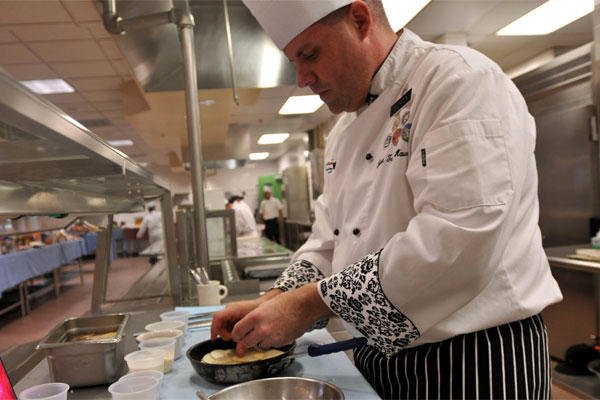 Army Sgt. Andrew Shurden prepares a potato dish during tryouts for the culinary arts team at Joint Base Lewis-McChord, Wash., Nov. 21, 2014. (Army photo by Sgt. James J. Bunn)