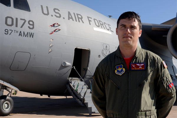 Air Force Tech. Sgt. Benjamin Gates, 58th Airlift Squadron operations flight chief, stands in front of a U.S. Air Force C-17 Globemaster III cargo aircraft Feb. 6, 2015. Courtesy photo