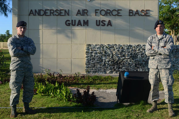 Airmen 1st Class Colby (left) and Travis Wakefield, 36th Security Forces Squadron entry controllers, stand at the entry to Andersen Air Force Base, Guam, July 29, 2015. (U.S. Air Force photo by Airman 1st Class Alexa Ann Henderson/Released)