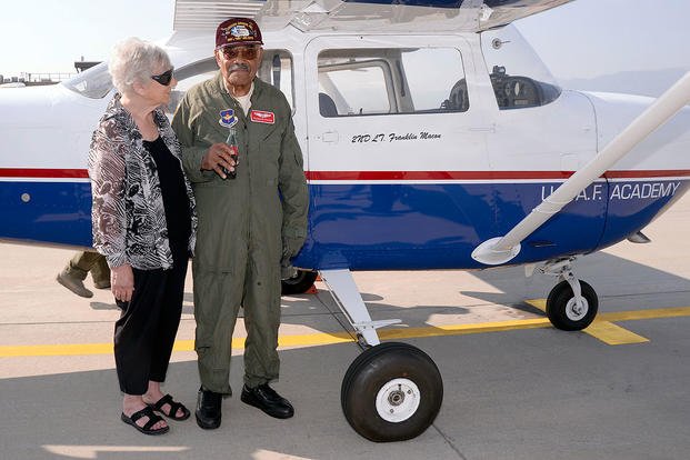 Franklin Macon, a Tuskegee Airman, with his girlfriend Amy Lee, on the U.S. Air Force Academy airfield, Aug. 25, 2015. Macon had just taken a flight with Cadet 1st Class Scott Lafferty in a cadet flying team T-41. (U.S. Air Force photo/Mike Kaplan)