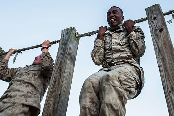 Lance Cpl. Calvin Sawyers conducts a max set of pull-ups after completing a 1.5 mile ruck run as part of a scout sniper screener at Marine Corps Base Camp Lejeune, N.C., Oct. 20, 2015. (U.S. Marine Corps/Cpl. Kirstin Merrimarahajara)