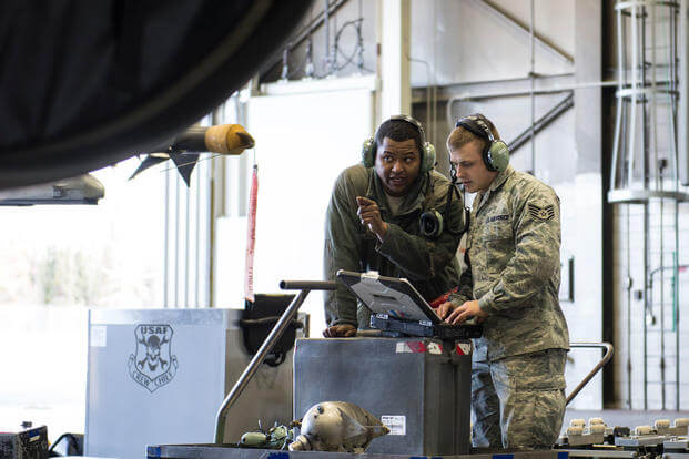 Senior Airman Terrence Lawrence and Staff Sgt. Eric Fitch, 354th Aircraft Maintenance Squadron maintenance specialists, troubleshoot an F-16 Fighting Falcon at Eielson Air Force Base, Alaska, Oct. 7, 2015. (Photo: Staff Sgt. Joshua Turner)